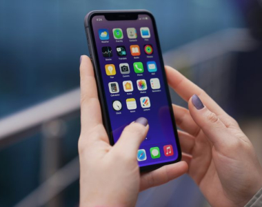 closeup of smartphone with apps in someone's hands