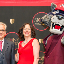Esmaili poses with SBU President and Wolfie (the Seawolf Mascot)