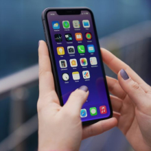 closeup of smartphone with apps in someone's hands