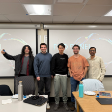 PhD panelists pose for a photo after the event. 